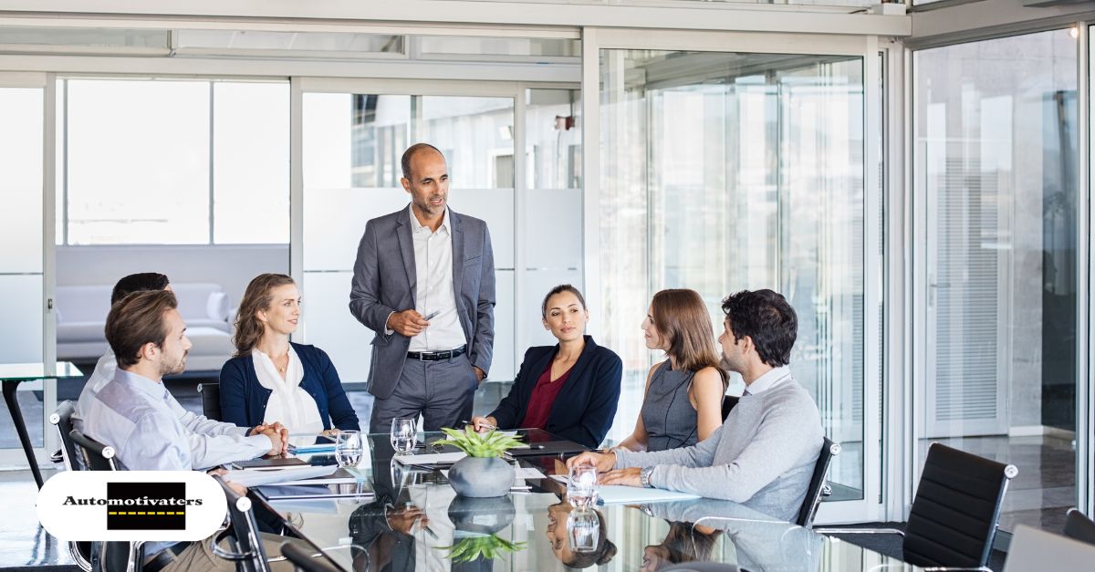 Supportive dealership team in an open discussion with empathetic leadership